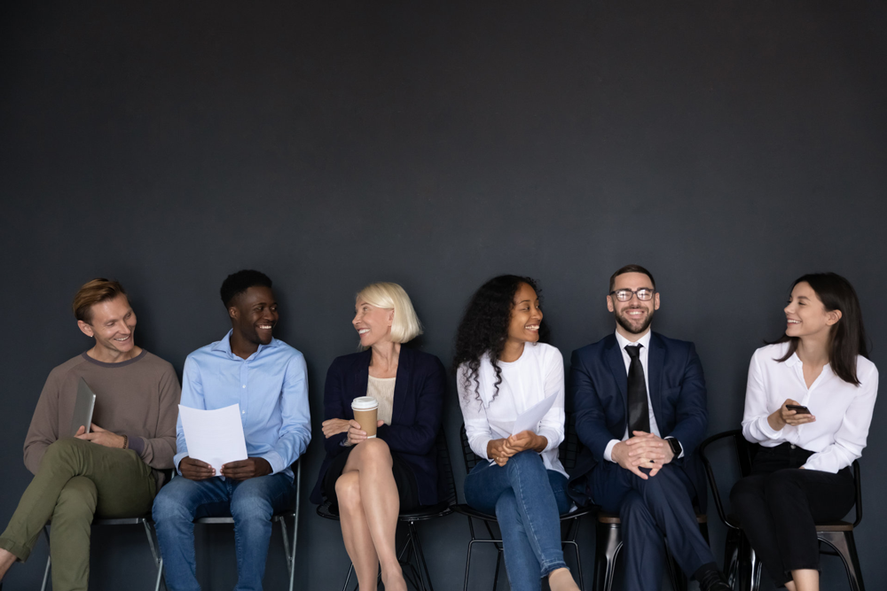 People on chairs, waiting for interview